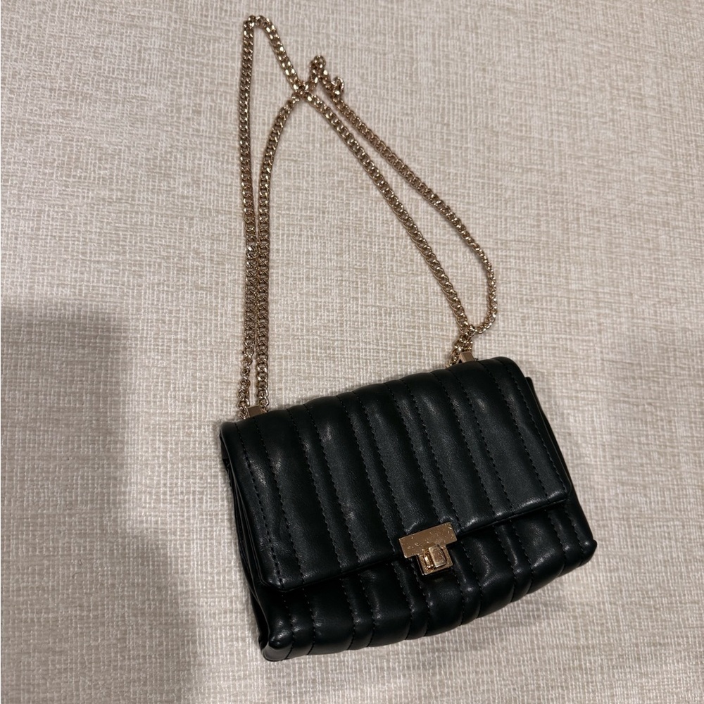Black Crossbody Bag with Quilted Texture and Gold Chain Strap